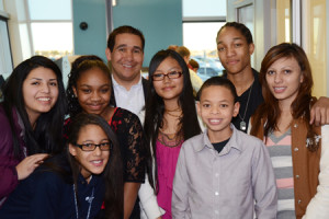 The members of the Youth Council pose with CEO Rich Martinez at the Branch Grand Opening.