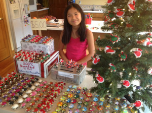 Maia shows off her supply of products before the 2012 Young Entrepreneurs Marketplace.