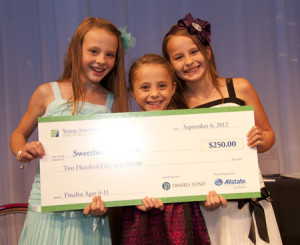 The Sweet Bee Sisters show off their finalist check during the 2012 Celebration for Young Entrepreneurs.