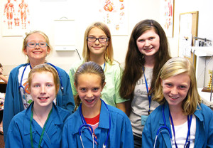 Girls Can summer campers pose in front of the Medical Center.