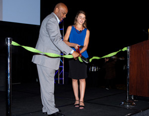 Mayor Michael Hancock and Mayor Sara Kurutz cut the ribbon to open Young AmeriTowne On the Road.