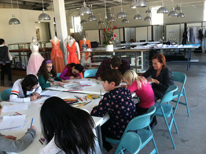 Young entrepreneurs working on their fashion designs.
