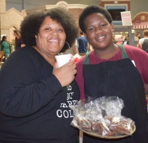 Andwele Gilbert, owner of Lil'Daddy's Stuffed Brownies, with his mother, Trisha