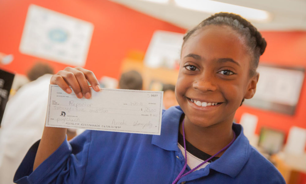 Girl Holding Paycheck cropped MC Girl Holding Paycheck cropped MC