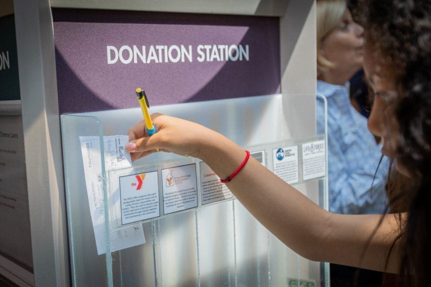 Girl Donating in YAT Donation Station