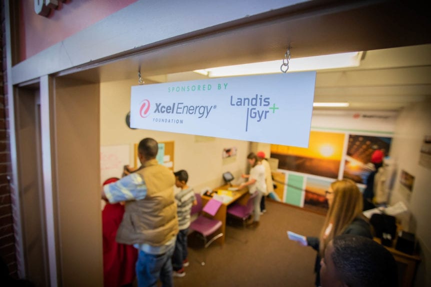 An Xcel Energy and Landis Gyr Sign in Young AmeriTowne is shown