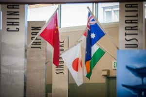 China, Japan, Singapore, Australia, and India flags shown from International Towne