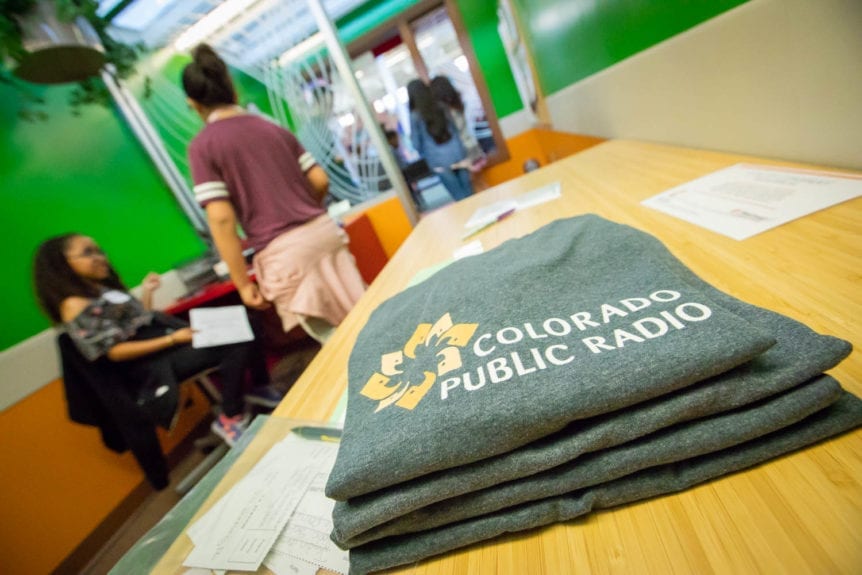 Colorado Public Radio T-Shirts on Table
