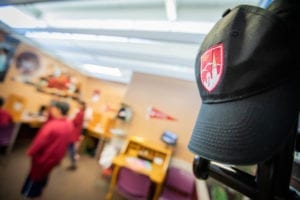 University of Denver College Hat on Stand in front of Young AmeriTowne College