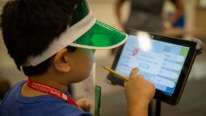 Student taps on tablet