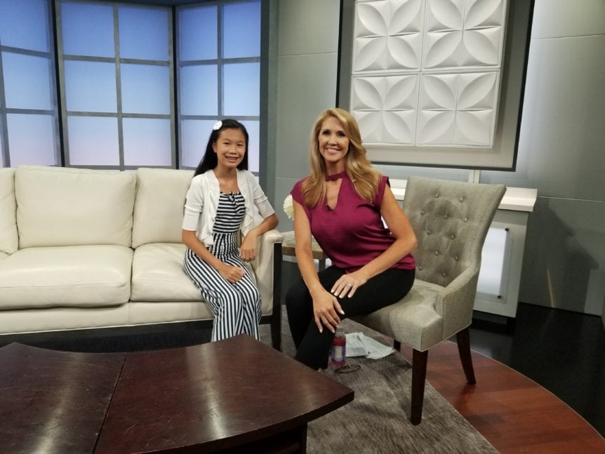 Hannah Reyes used her initials to create the name of her business, HER Designs four years ago when she was eight.  She sells a variety of products, including hairclips, mirrors, popsockets, and mini-personal alarms, but all have a signature rosette that she hand-makes out of fabric.  Hannah is a finalist in the 2019 Spotlight on YouthBiz Stars business competition.

Learn more about Hannah below, and watch her segment on Colorado & Company !

Question: Tell me a little bit about you – name, age, how long you’ve been an entrepreneur?

Answer: Hi, My name is Hannah Reyes and I am the owner of HER Designs, I am 12 years old.   I have been in business for 4 years.  I started HER Designs when I was 8 years old.

Q: Do you have a website? If so, let us know what it is.

A: My website is www.herdesigns.net . You can also follow me in Facebook and Instagram under HER Design Store.

Q: What motivated or inspired you to start a business?

A: Initially, I was inspired to make products for my own use. For example, I started making the rosette clips so I can use them for my hair.  Then people start noticing them and wanted to buy them.  The same thing happened for most of my other products. Another example is for my latest product, the mini-personal alarm.  I was inspired to have a gadget for girls safety in time for my service trip to Peru.   That’s when my mini personal alarm product was born.

Q: Please share an overview about your business.

A: My initial is HER which stands for Hannah Elizabeth Reyes. This is the inspiration for my business name.   HER Designs sells hair clips and other accessories.   In all of my products, I have maintained the rosette as a signature design.  I have now established sub-brands for HER Designs such as HER Safety for my mini personal alarms and HER School Spirit for custom made hair accessories to match school uniforms.

My latest product is my mini personal alarm that you can attach to your bag or belt.  It sounds loud when pulled and it works to catch attention whenever you feel unsafe.

Q: Tell us about some of the challenges you face being a young business owner.

A: The hardest part in running a business as a young entrepreneur is having the access to selling products.   When I started looking at retail opportunities and people hear that I am only 12, the first reaction is to turn me down.   I have learned that these types of experiences shouldn’t discourage me and other young business owners but rather gives me more inspiration to stand up,  do better and try again.  It gives me a voice to say that age does not matter in making quality products.

Q: Why should other youth start a business?

A: You learn so many life skills in starting a business.   You learn to be creative and try new things.  You learn how to deal with successes and failures which will be valuable later in life.

Q: What’s the best part about having your own business?

A: The best part for me is making my products – being creative with it, figuring out how to innovate and trying something new.   I love learning how to make good quality products and meeting a lot of people.     All these while pursuing something that I love to do.

Q: So, you’re one of the finalists for the Spotlight on YouthBiz Stars business competition–congratulations! What motivated you to apply for the competition, and what do you hope to get from this experience?

A: I am really excited to be one of the finalists this year.  This is my second year to join the competition.  I was a finalist last year as well.   My business improved a lot since last year’s competition and I got motivated to join again to further improve my business exposure.

Q: Please share about your involvement with Young Americans.

A: I am really thankful for what Young Americans does for youth.  They gave me the opportunity to sell my products when I started.   Young Americans is inspiring kids to try something new and learn along the way.  I have been selling in their Marketplaces for 4 years now.  Also, they are giving me the opportunity to share my story and provide guidance to kids who are thinking of starting a business.