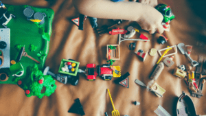 A child with many toys is shown