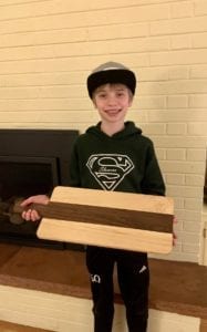 Axel Fontaine showing off one of his cutting boards