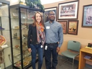 Two Chase Bank volunteers smile while working in International Towne