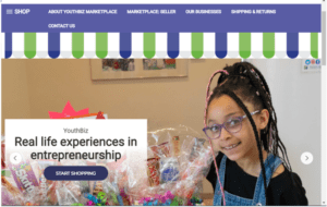 Real Life Experience in Entrepreneurship Iconography with a young girl selling product at a YouthBiz Marketplace booth. She is standing behind baskets.