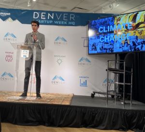 Gabriel Nagel Pitching at Denver Startup Week Finals with slides in background