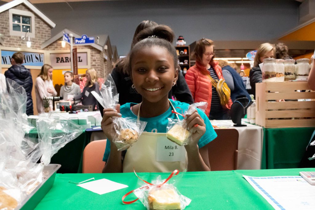 Mila poses with her baked goods