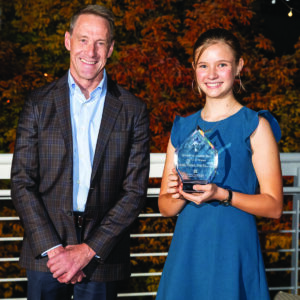 Jim Reuter and Hannah Doolittle pose with Hannah's trophy.